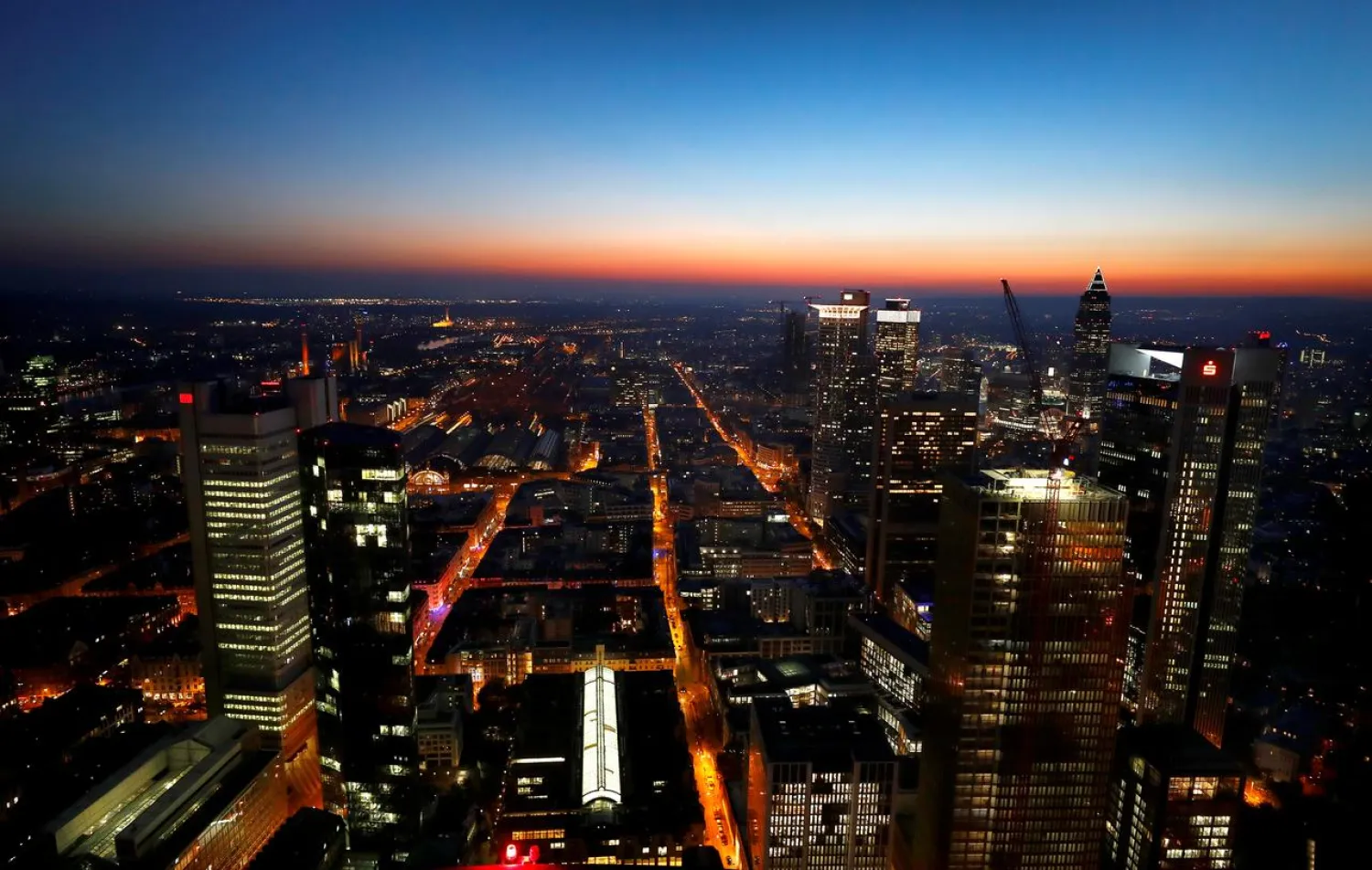 FILE PHOTO: The sun sets behind the financial district early evening in Frankfurt, Germany, October 10, 2018. REUTERS/Kai Pfaffenbach