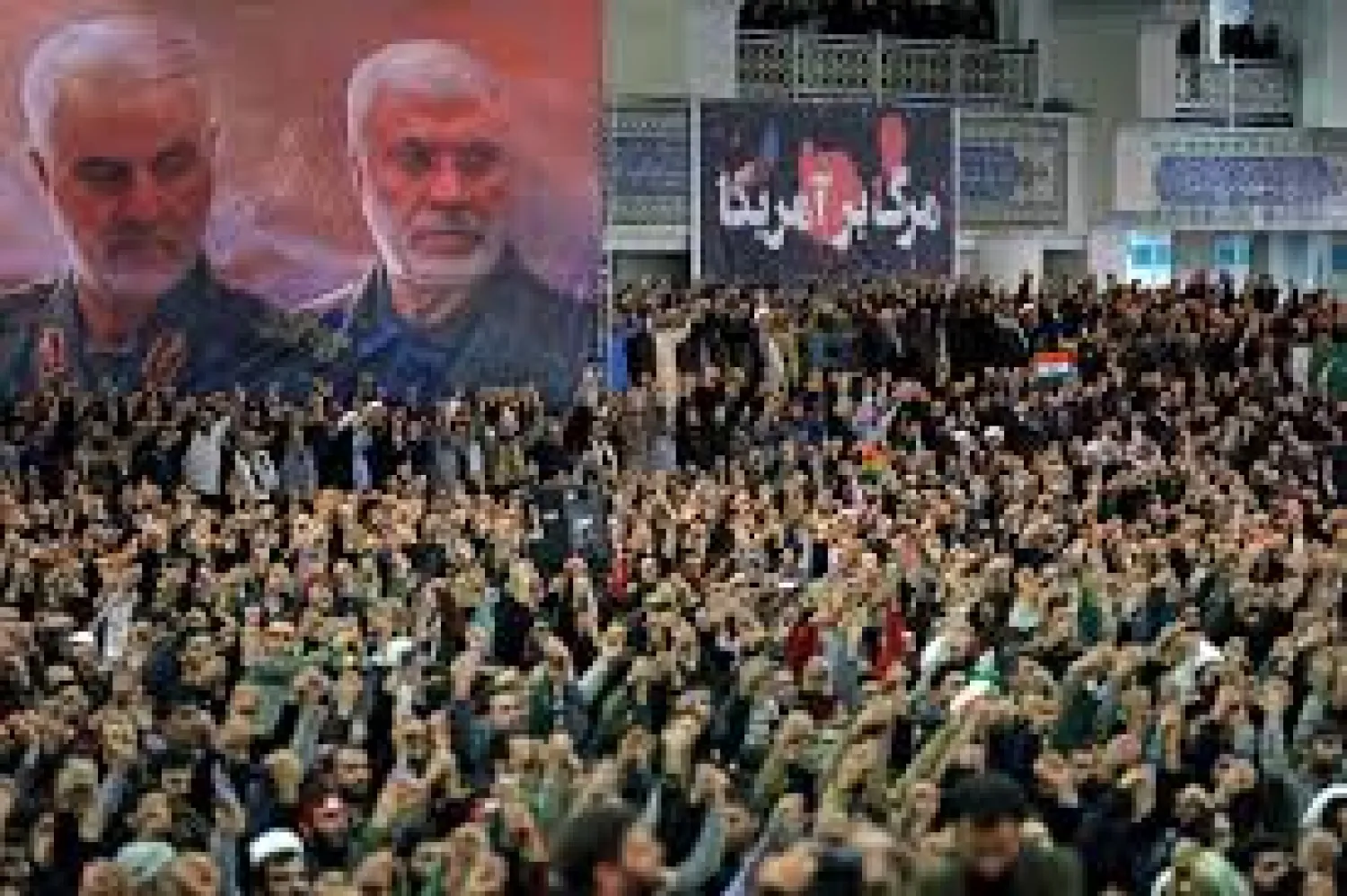 In this picture released by the official website of the office of the Iranian supreme leader, worshippers chant slogans during Friday prayers ceremony, as a banner show Iranian Revolutionary Guard Gen. Qassem Soleimani, left, and Iraqi Shiite senior militia commander Abu Mahdi al-Muhandis, who were killed in Iraq in a US drone attack on Jan. 3, and a banner which reads in Persian: "Death To America, "at Imam Khomeini Grand Mosque in Tehran, Iran, Friday, Jan. 17, 2020. (Office of the Iranian Supreme Leader via AP)
