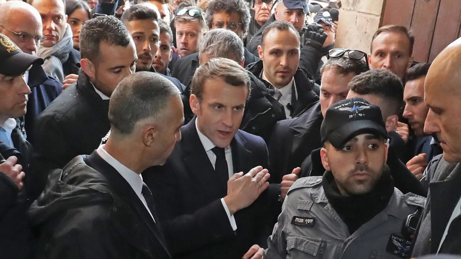 French President Emmanuel Macron asks Israeli security forces to leave the 12th-century Church of St. Anne in the old city of Jerusalem on Wednesday. (AFP)