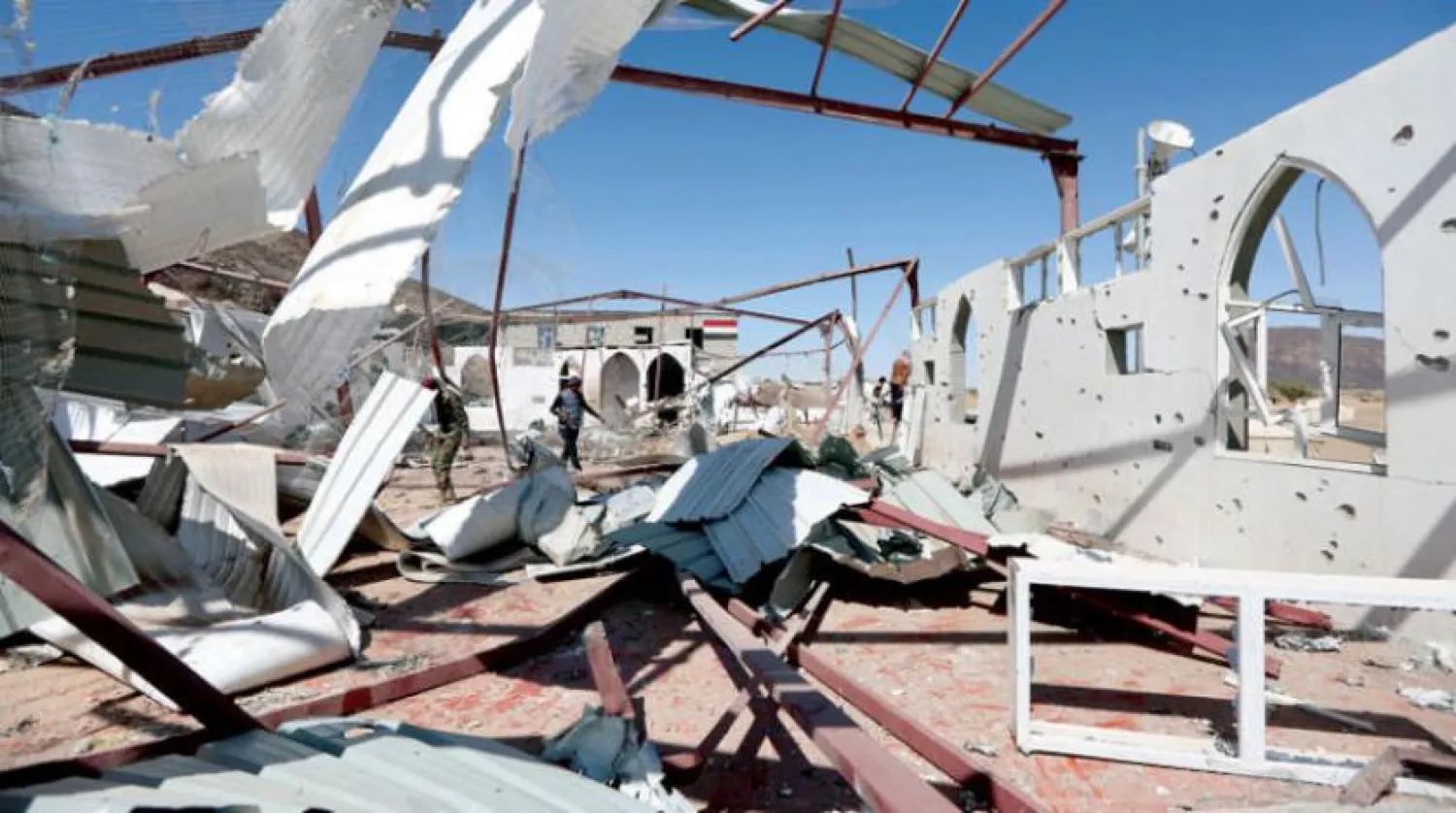Government soldiers and other people inspect the site of a Houthi missile attack on a military camp’s mosque in Marib, Yemen January 20, 2020. REUTERS/Ali Owidha