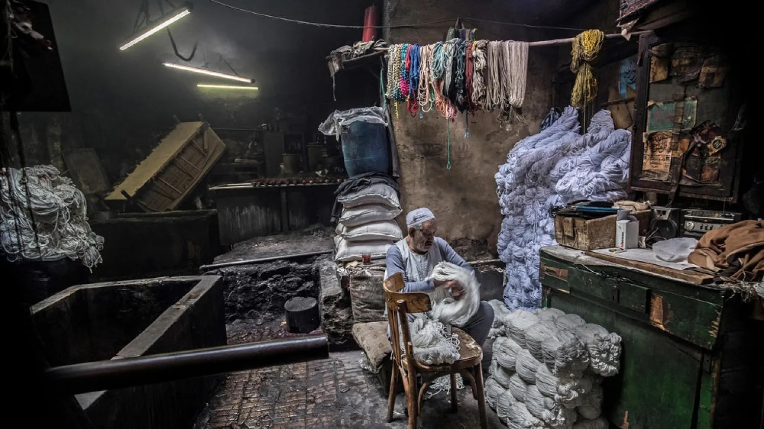 Salama Mahmoud Salama, 83, in his traditional hand-dying workshop in Cairo's centuries-old Darb al-Ahmar district. (AFP)
