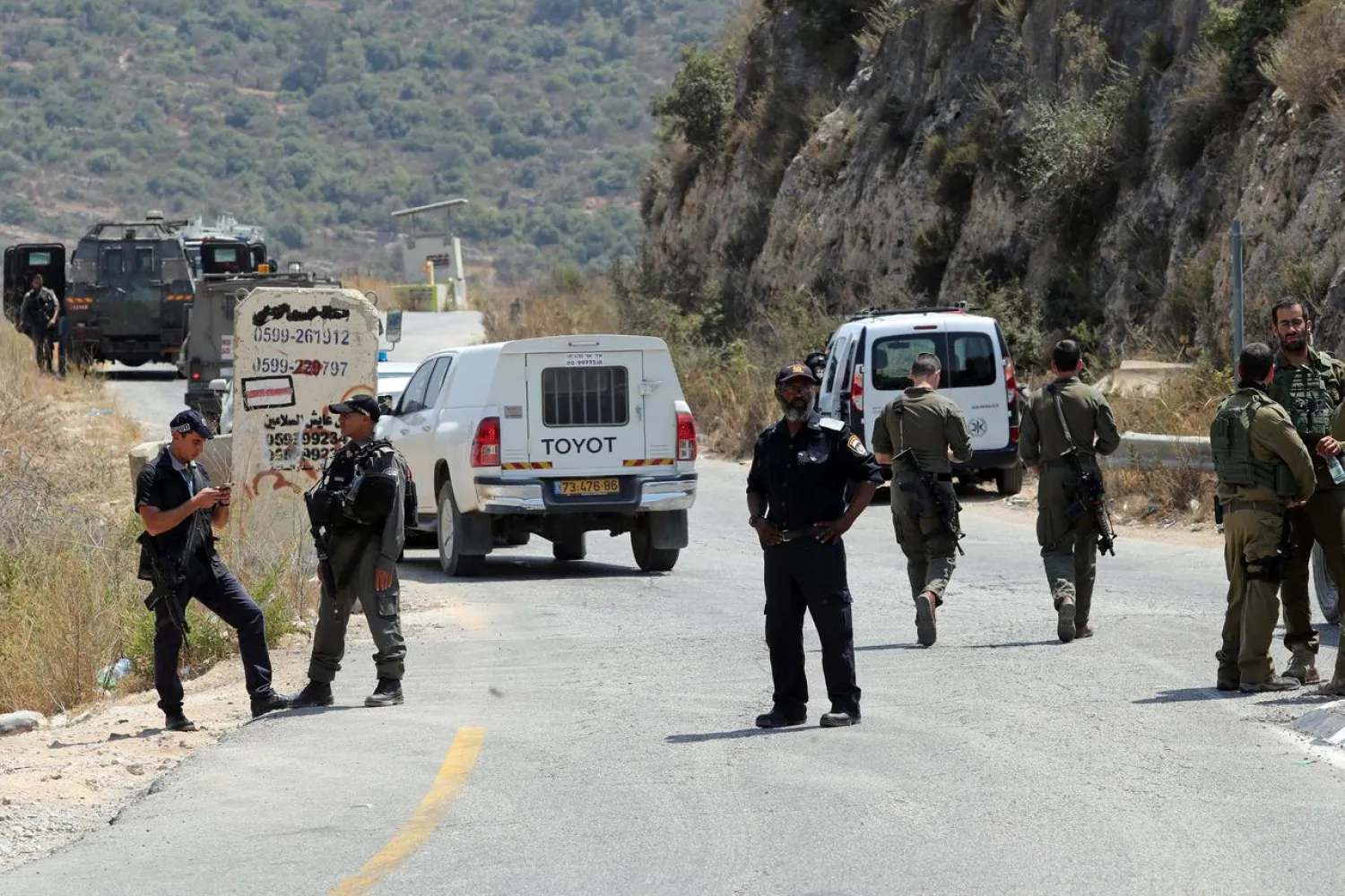 Israeli forces gather at the scene of an attack near the Jewish settlement of Dolev in the Israeli-occupied West Bank August 23, 2019. (Reuters)