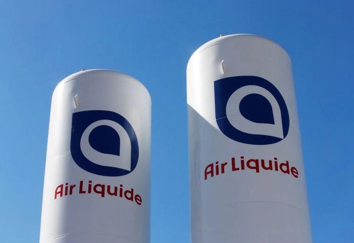 FILE PHOTO: The Air Liquide logos are displayed at the Alteo calcined alumina production plant in Gardanne, near Marseille, France, March 22, 2019. REUTERS/Jean-Paul Pelissier/File Photo