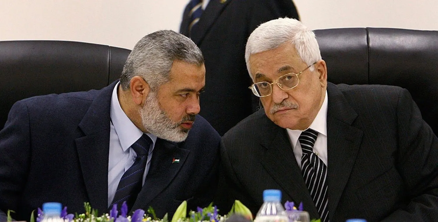 Palestinian President Mahmoud Abbas with head of Hamas political bureau Ismail Haniyeh (File photo: Reuters)