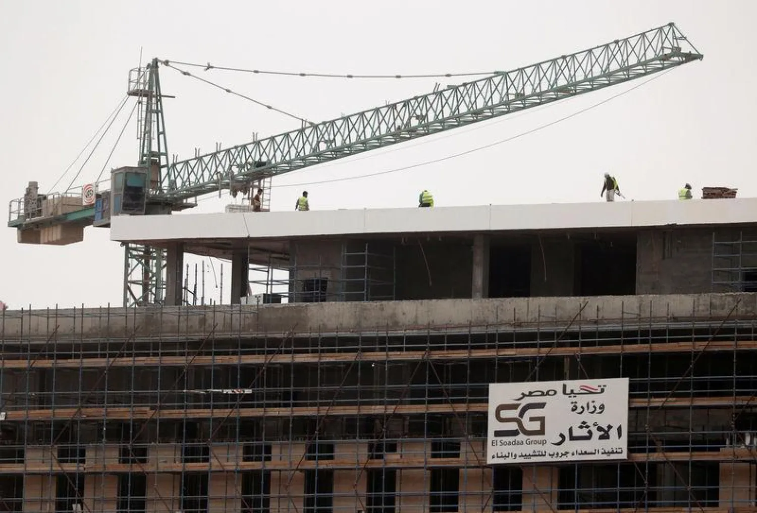 A crane and laborers work at the future headquarters Ministry of Antiquities at the new government district in the New Administrative Capital (NAC) east of Cairo, Egypt May 2, 2019. REUTERS/Amr Abdallah Dalsh
