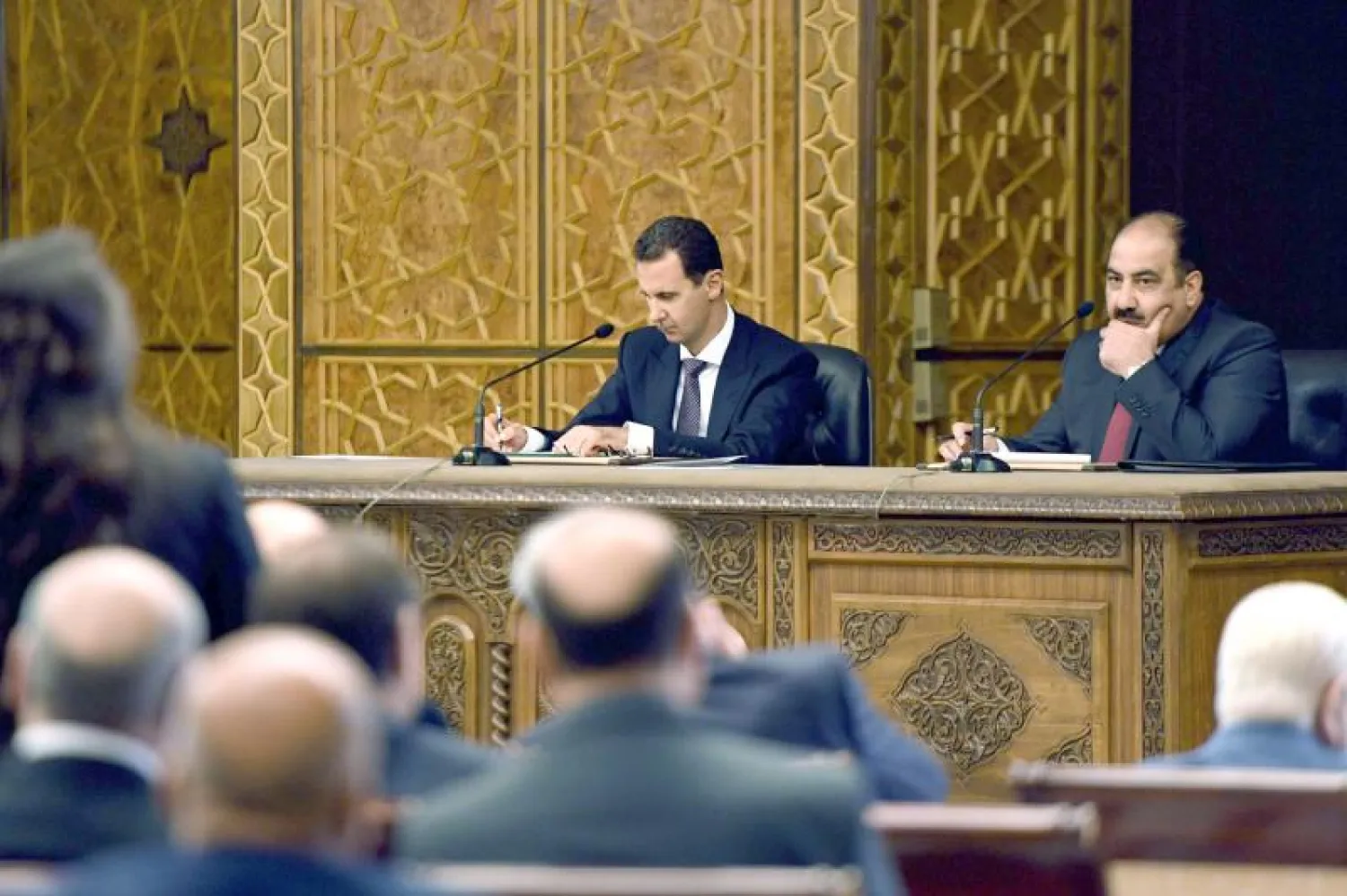 Syria’s President Bashar Assad (L) chairs the central committee of the ruling Baath party in Damascus (AFP)
