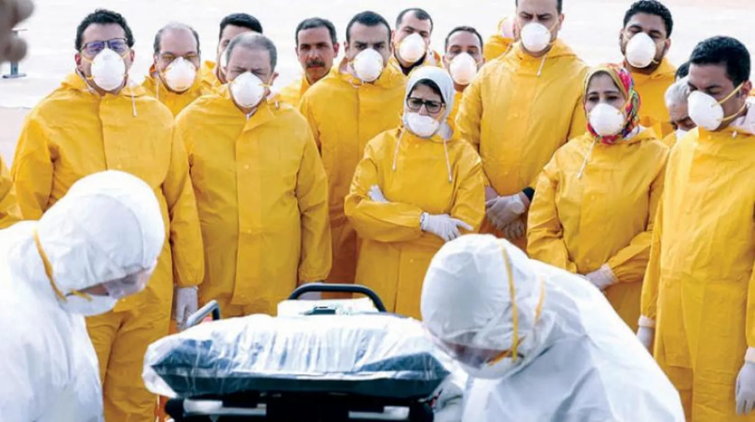 Egyptian Minister of Health mediates a medical team, which received the repatriates from Wuhan, China on Monday, February 3, 2020 (Reuters)