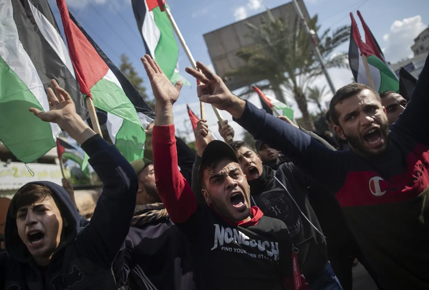 Palestinian protesters chant angry slogans during a protest against the US Middle East peace plan, in Gaza City, Monday, Jan. 28, 2020. (AP)