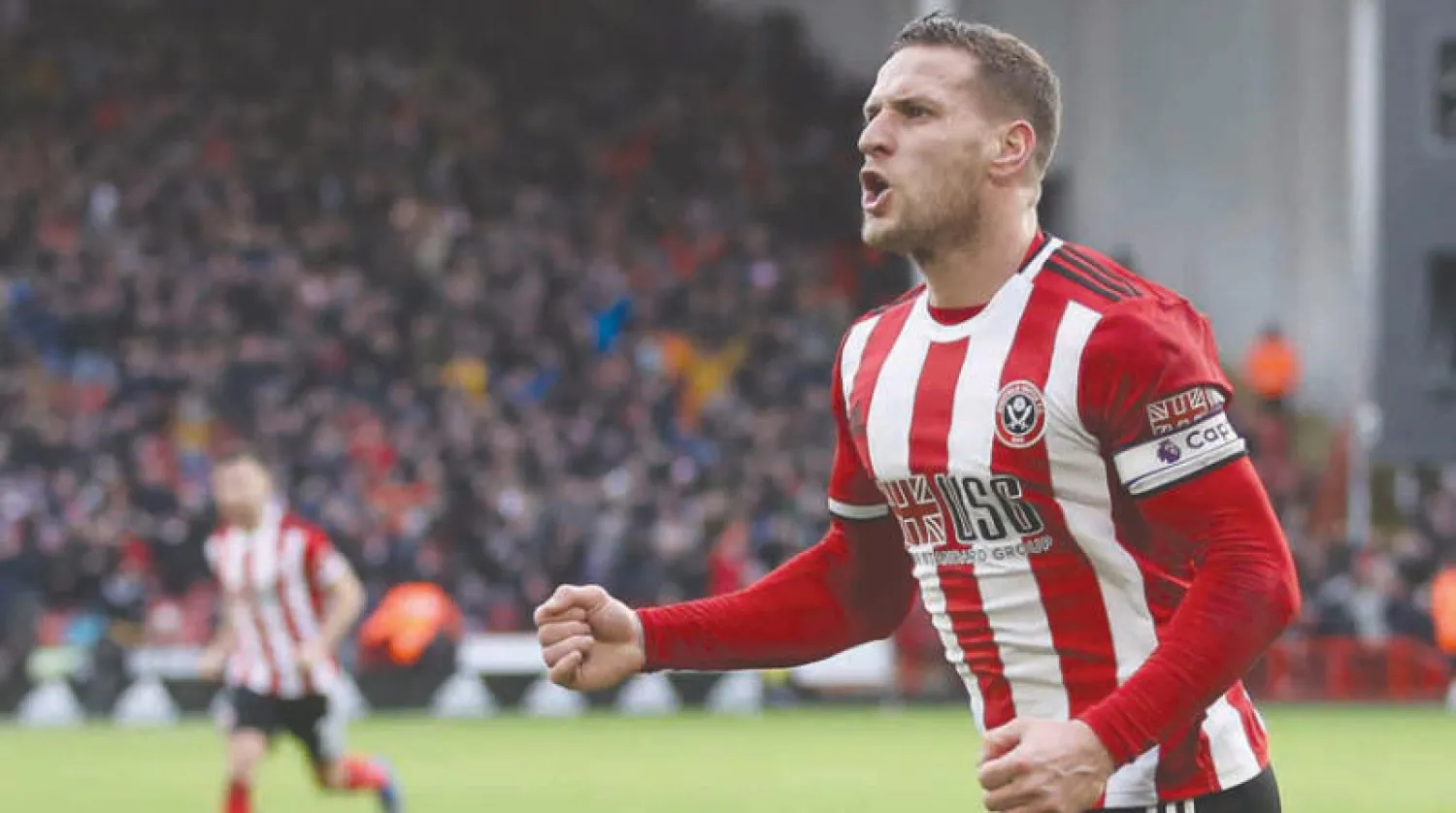 بيلي شارب يحتفل بهدفه الذي أسهم في منح شيفيلد الفوز على بورنموث (رويترز)