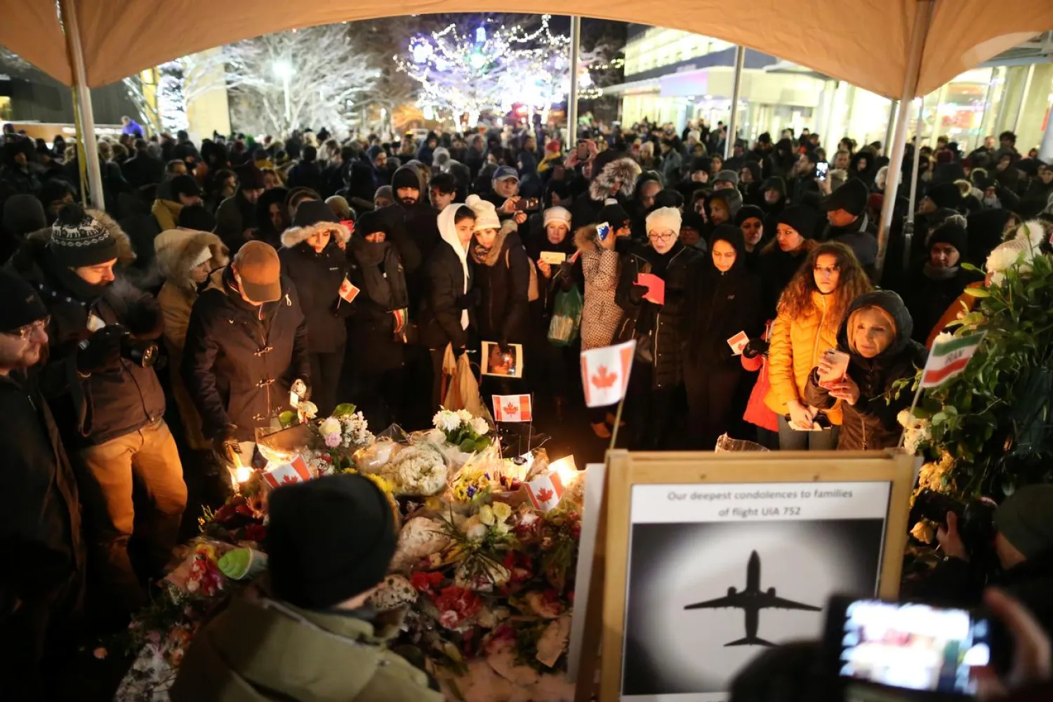 Mourners attend a vigil for the victims of a Ukrainian passenger jet which was shot down in Iran, in North Vancouver, British Columbia, Canada January 14, 2020. (Reuters)