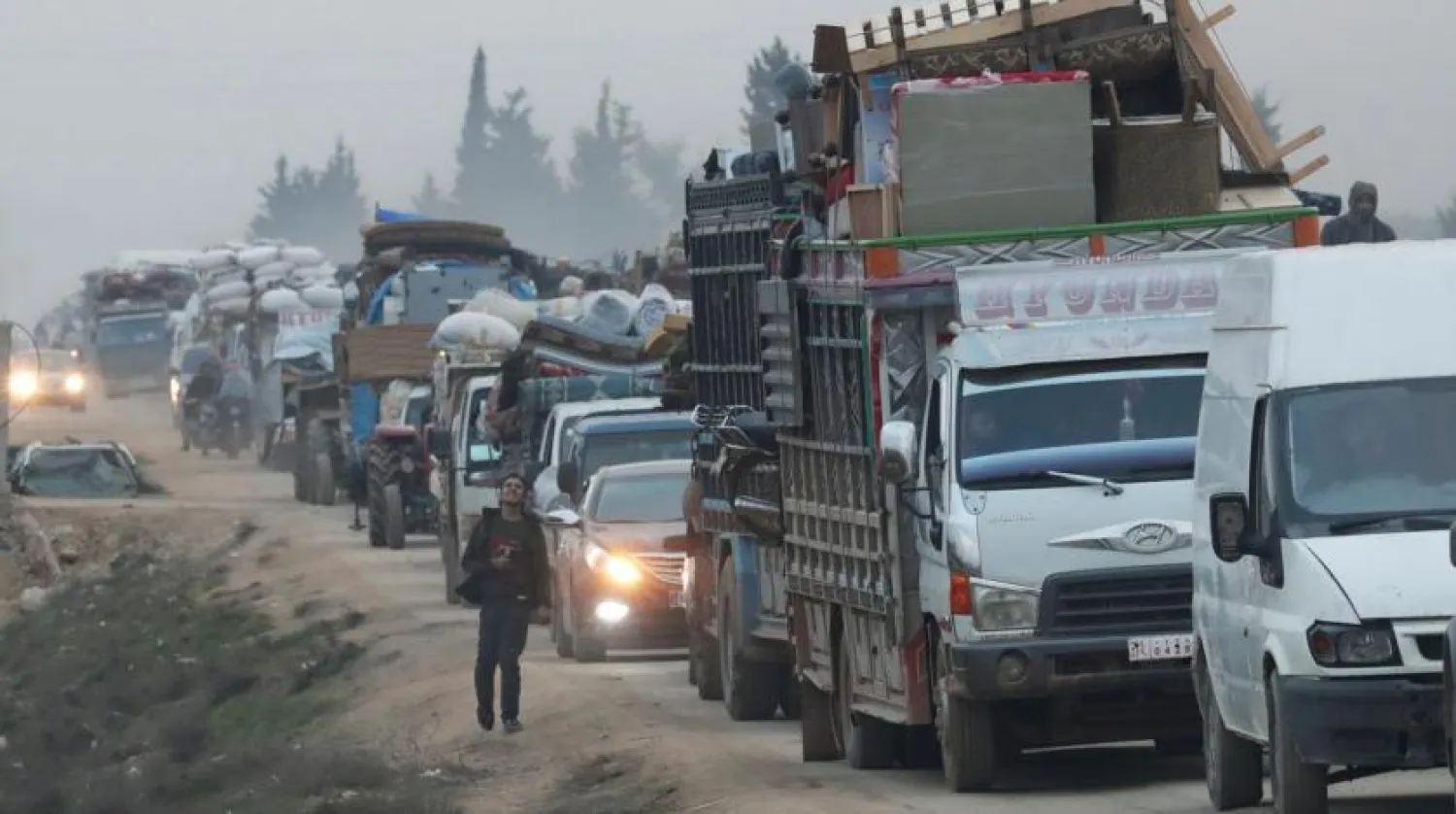 A view of trucks carrying belongings of displaced Syrians, is pictured in the town of Sarmada in Idlib province, Syria, January 28, 2020. REUTERS/Khalil Ashawi/File Photo
