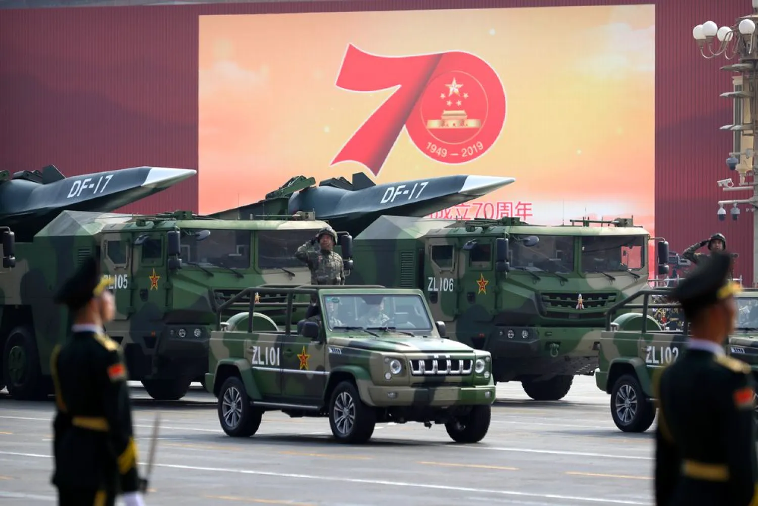 Chinese military vehicles carrying DF-17 ballistic missiles roll during a parade to commemorate the 70th anniversary of the founding of Communist China in Beijing, Tuesday, Oct. 1, 2019. (AP Photo/Mark Schiefelbein)