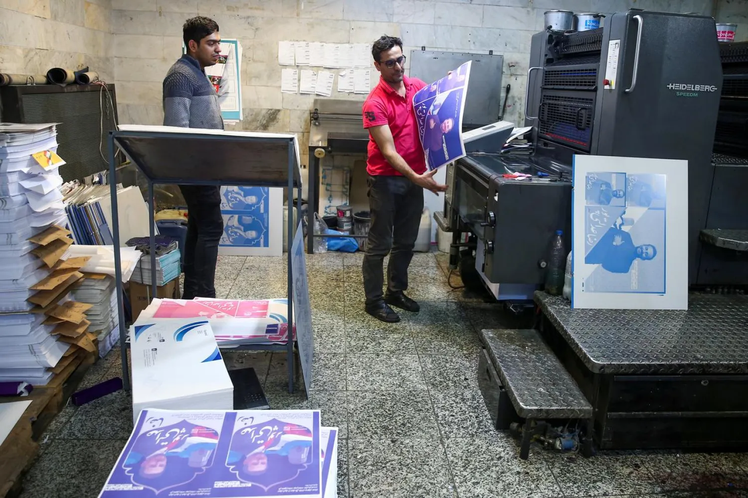Parliamentary election campaign posters prepare at a publication store in Tehran, Iran February 13, 2020. (Reuters)