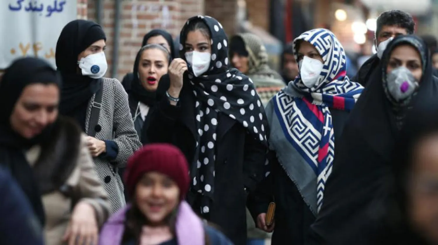 Iranian women wearing protective masks to prevent contracting a coronavirus walk at Grand Bazaar in Tehran, Iran February 20, 2020. WANA (West Asia News Agency)/Nazanin Tabatabaee via REUTERS