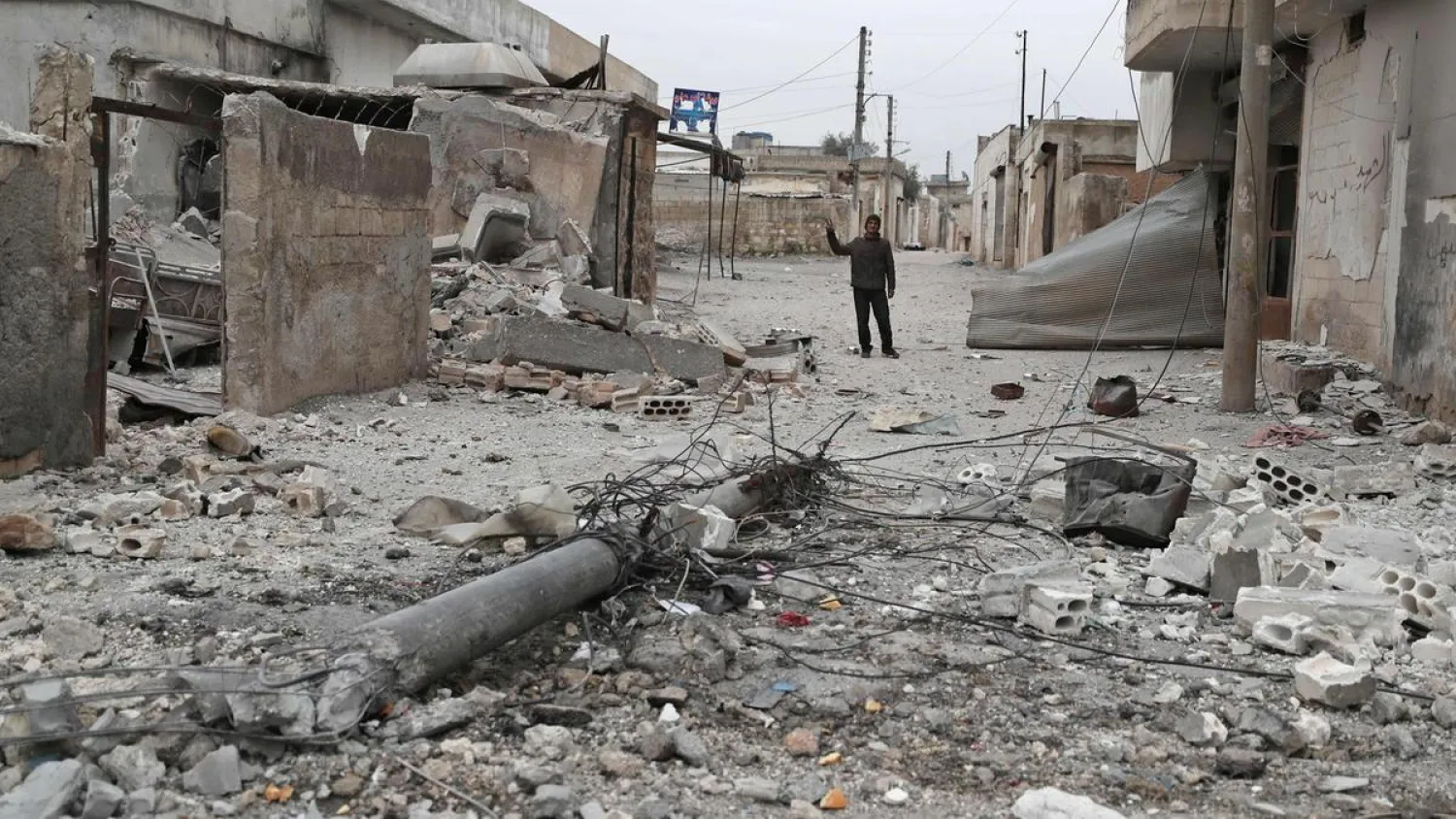 A man inspects the damage in the village of Maaret al-Naasan in Syria's Idlib province. (AFP)