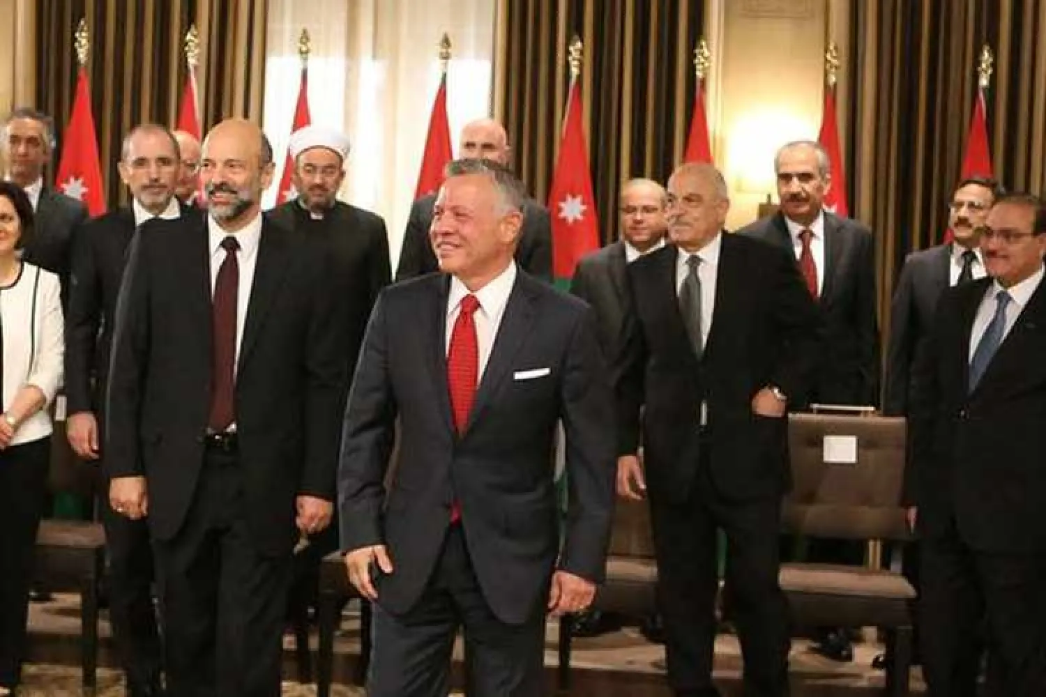 Jordan’s King Abdullah II with Prime Minister Omar al-Razzaz during a swearing-in ceremony of the new cabinet in Amman, Jordan June 14, 2018. (Reuters/Handout)