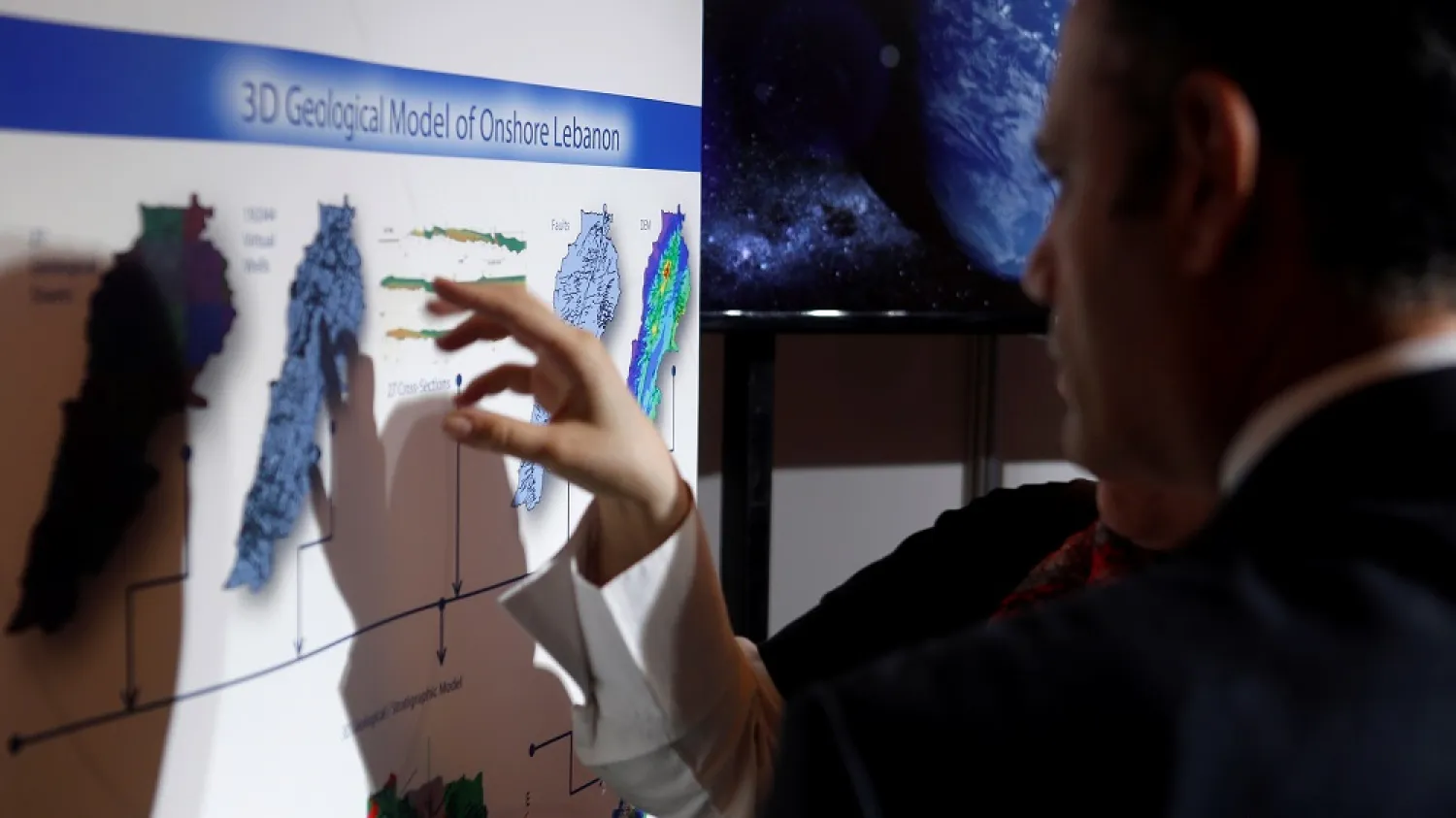 People inspect maps of Lebanon during the third Lebanon International Oil and Gas Summit, Beirut, Lebanon, May 9, 2017. (Reuters)