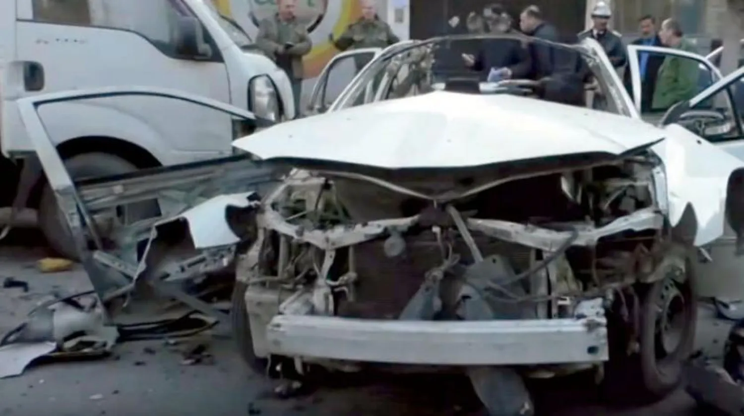 Şam'da bombalı saldırının ardından hasar gören araç (SANA)