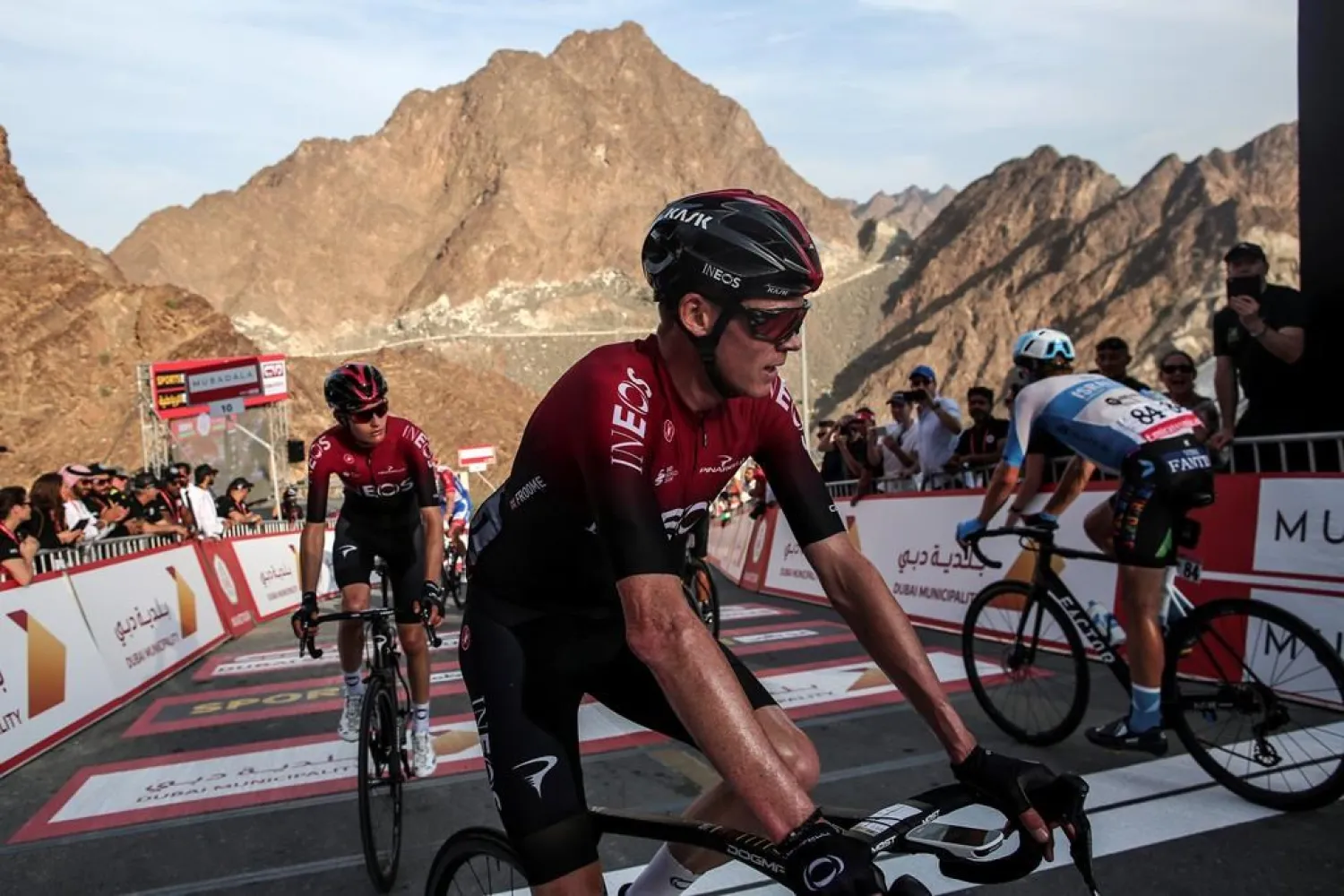 England's Chris Froome of Ineos Team crosses the finish line after the second stage of the UAE cycling tour in Dubai, United Arab Emirates, Monday, Feb, 24, 2020. (AP Photo/ Mahmoud Khaled)