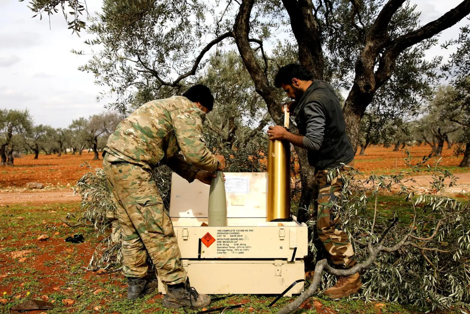 Syrian fighters prepare shell cases to an artillery near Idlib, Syria February 27, 2020. Reuters/Umit Bektas