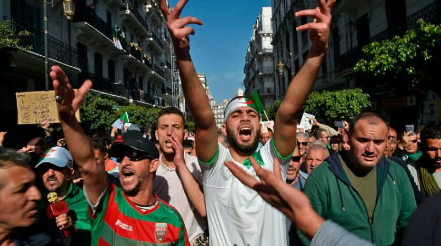 Algerian demonstrators chant slogans during a demonstration in the capital Algiers, on February 28, 2020. (Photo by RYAD KRAMDI / AFP)