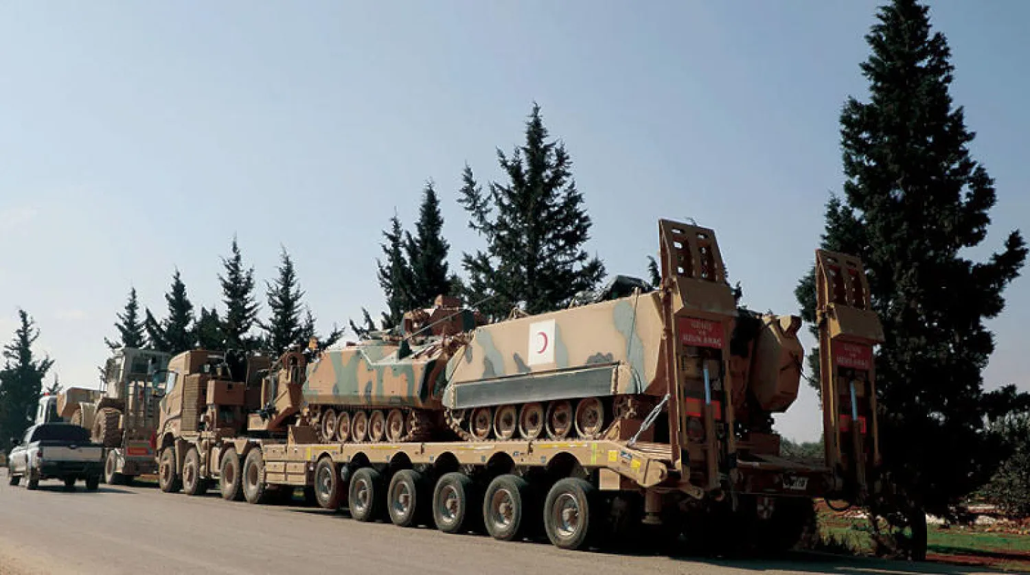 قافلة عسكرية تركية في حزانو بريف إدلب أمس (أ.ف.ب)