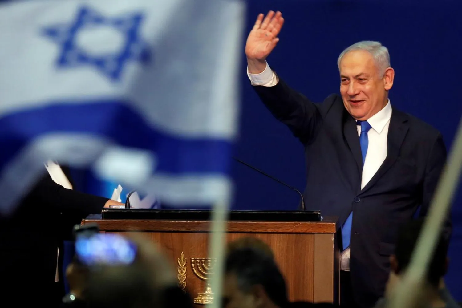 Israeli PM Benjamin Netanyahu waves to supporters following the announcement of exit polls in Israel's election at his Likud party headquarters in Tel Aviv, Israel March 3, 2020. (Reuters)