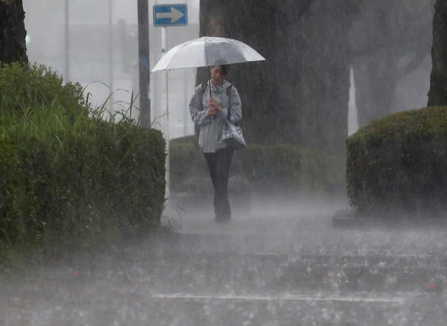 A pedestrian walks through heavy rain in Kirishima, Kagoshima Prefecture, southwestern Japan, July 3, 2019, in this photo taken by Kyodo. Mandatory credit Kyodo/via REUTERS

