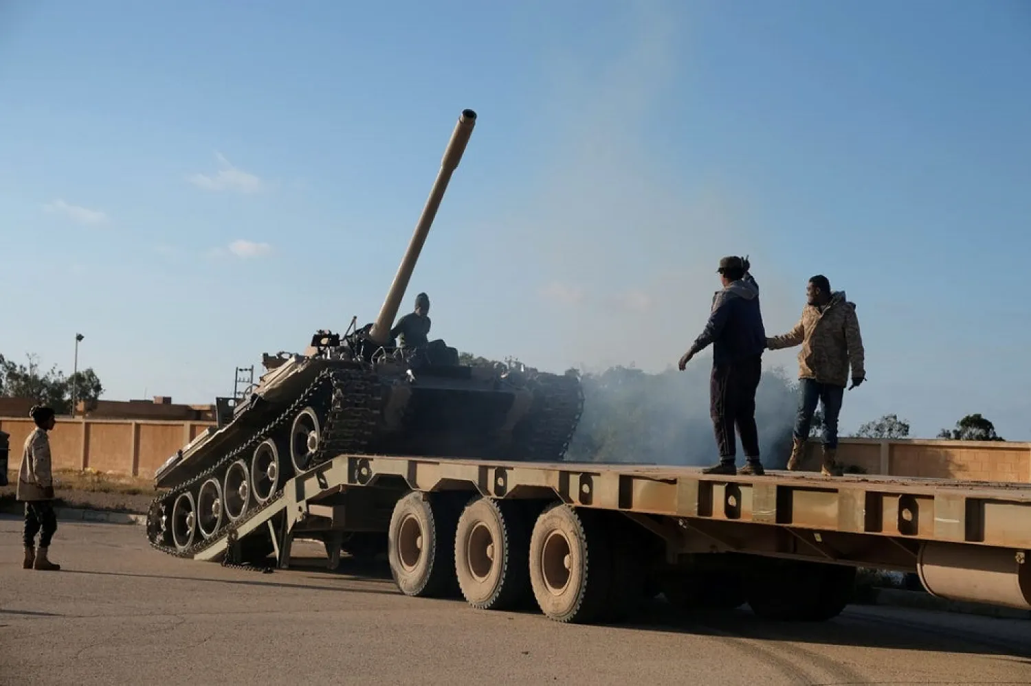 Members of the LNA get ready before heading out of Benghazi to reinforce the troops advancing to Tripoli, in Benghazi. (Reuters)