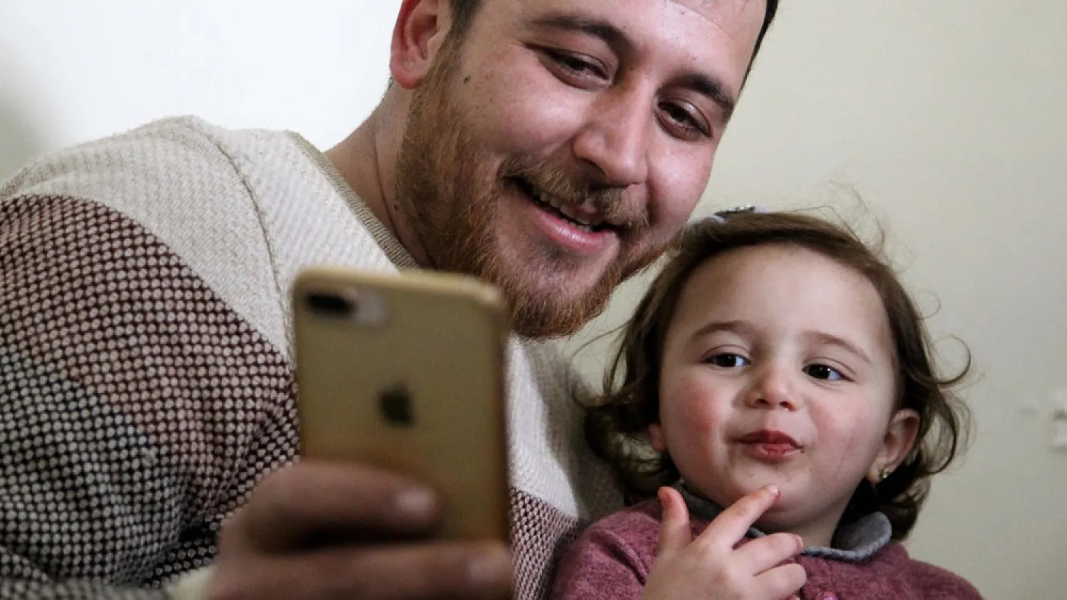 Syrian father Abdullah al-Mohammed with his three-year-old daughter Salwa. (AFP)