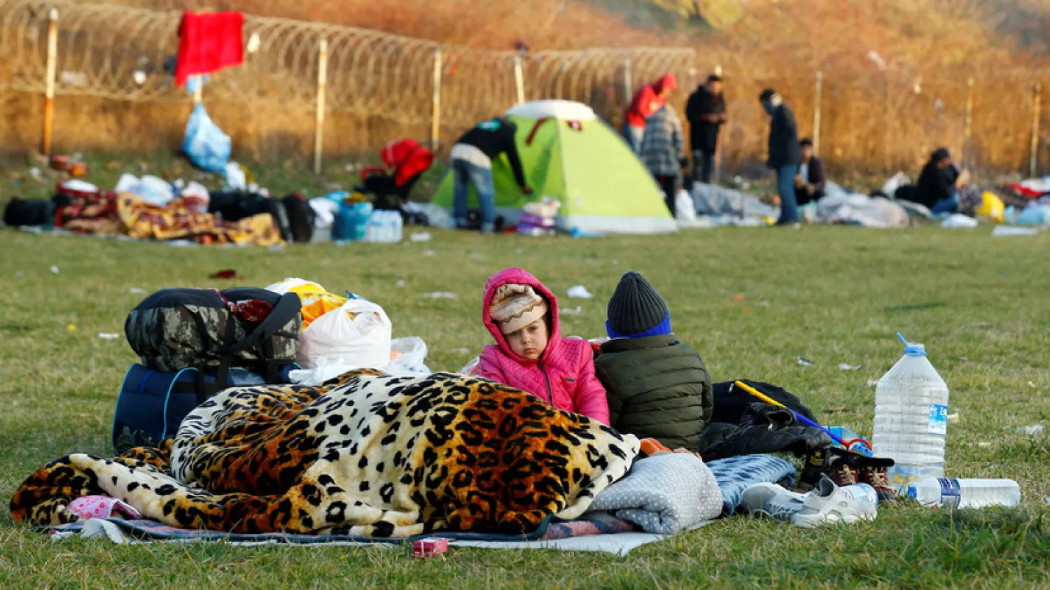 Migrant children are seen near Turkey's Pazarkule border crossing with Greece's Kastanies, near Edirne, Turkey, March 7, 2020. REUTERS/Huseyin Aldemir