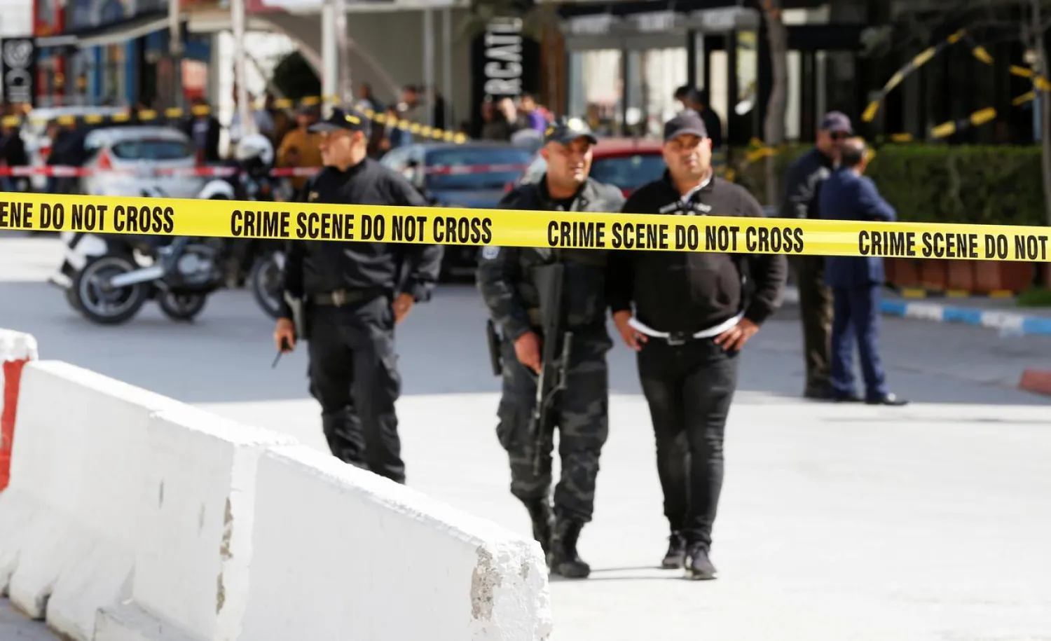 Police officers stand guard at the site of a suicide attack near the US Embassy in Tunis, Tunisia March 6, 2020. REUTERS/Zoubeir Souissi