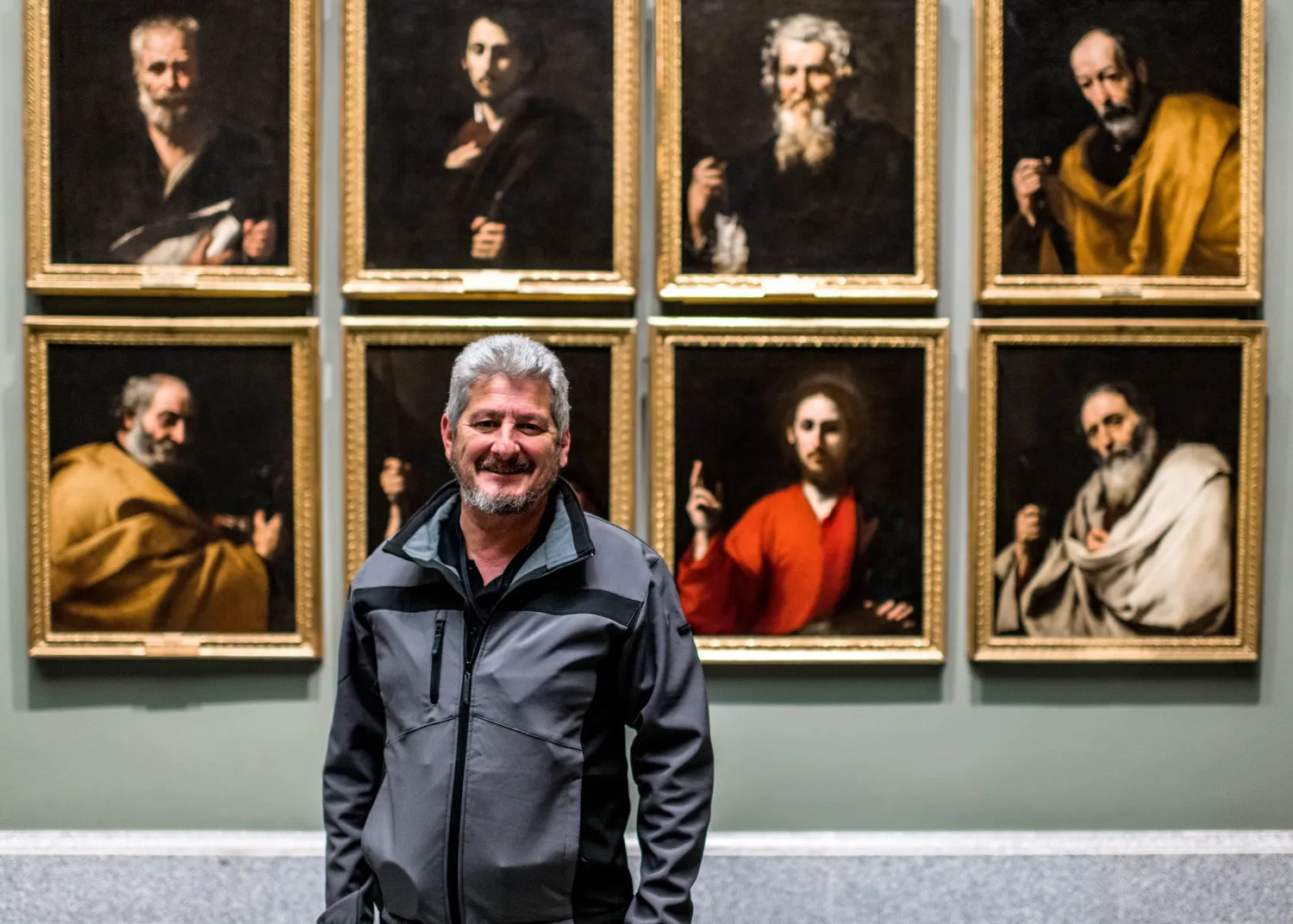 Manolo Osuna, a guard at the Prado Museum, in front of paintings by Jusepe de Ribera there in February.Credit...Emilio Parra Doiztua for The New York Times