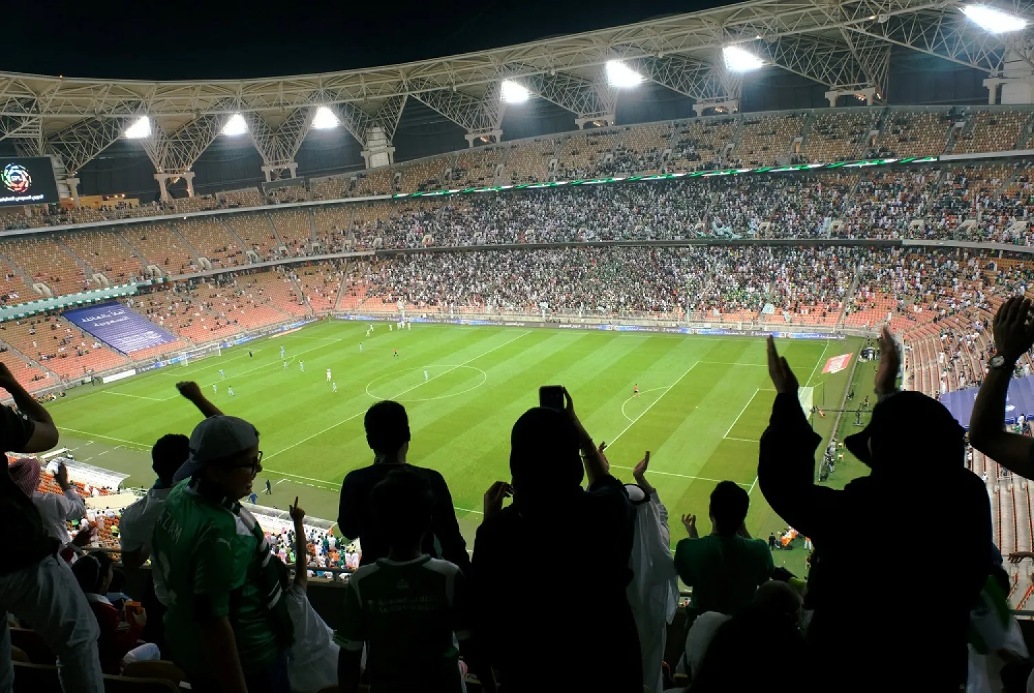 Saudi fans attend a football match at the King Abdullah Sports City in Jeddah, Saudi Arabia in January 2018. (Reuters)