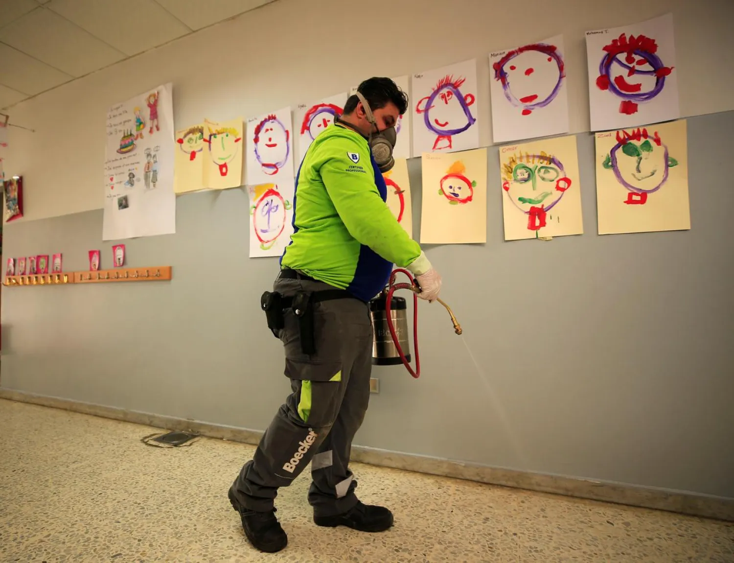 An employee from a disinfection company sanitizes a closed school, as a precaution against the spread of the coronavirus, in Sidon, Lebanon February 29, 2020. REUTERS/Ali Hashisho
