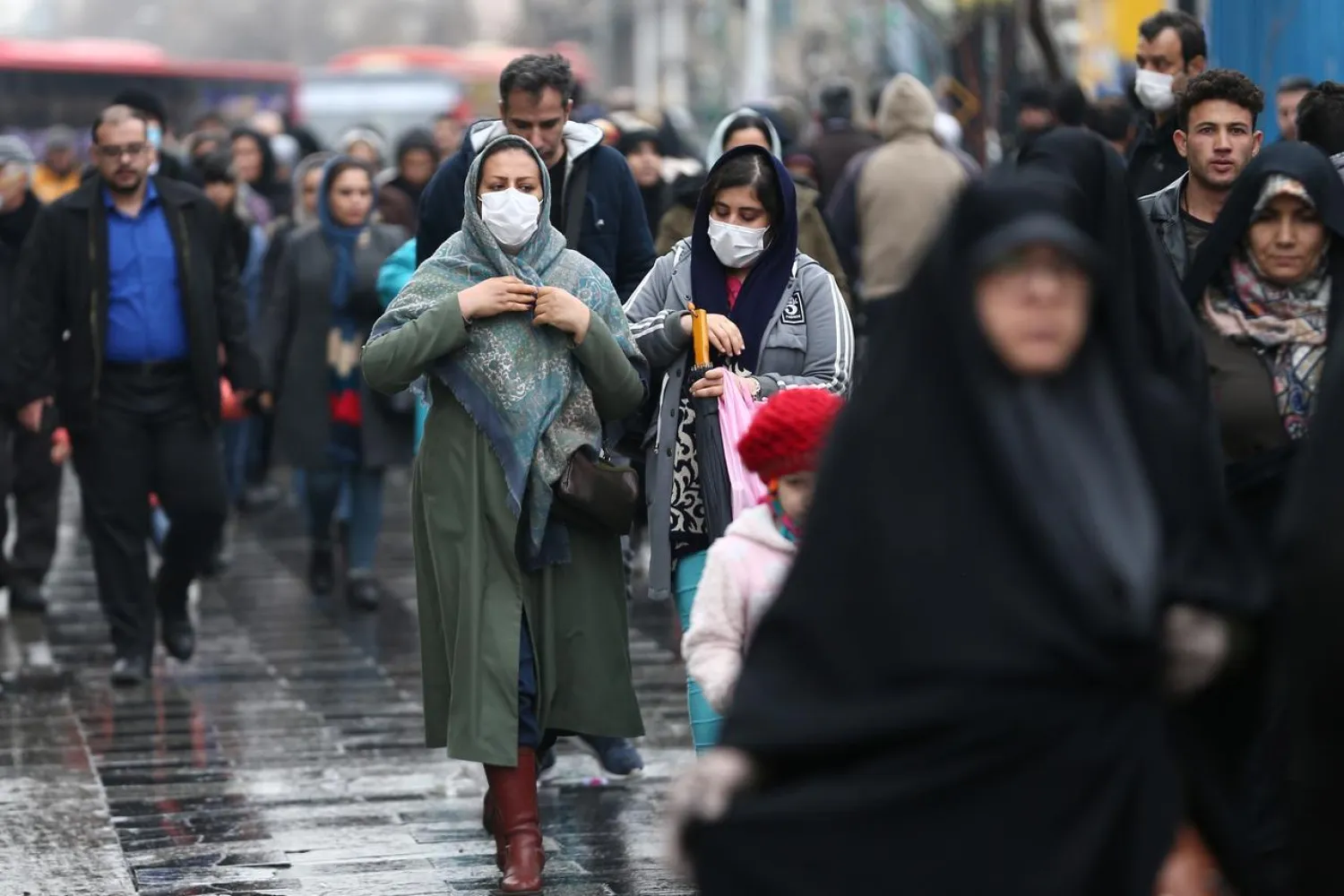FILE PHOTO: Iranian women wear protective masks to prevent contracting a coronavirus, as they walk at Grand Bazaar in Tehran, Iran February 20, 2020. WANA (West Asia News Agency)/Nazanin Tabatabaee via REUTERS
