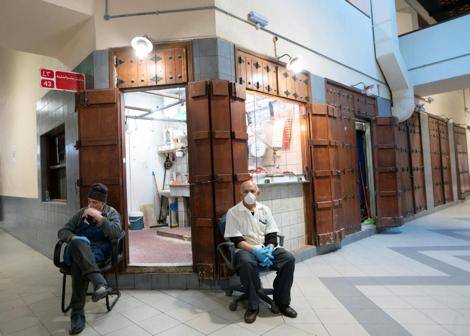 A meat butcher wears a protective face mask, following the outbreak of coronavirus, as he waits for customers at Mubarikiya market in Kuwait City, Kuwait March 12, 2020. (Reuters)