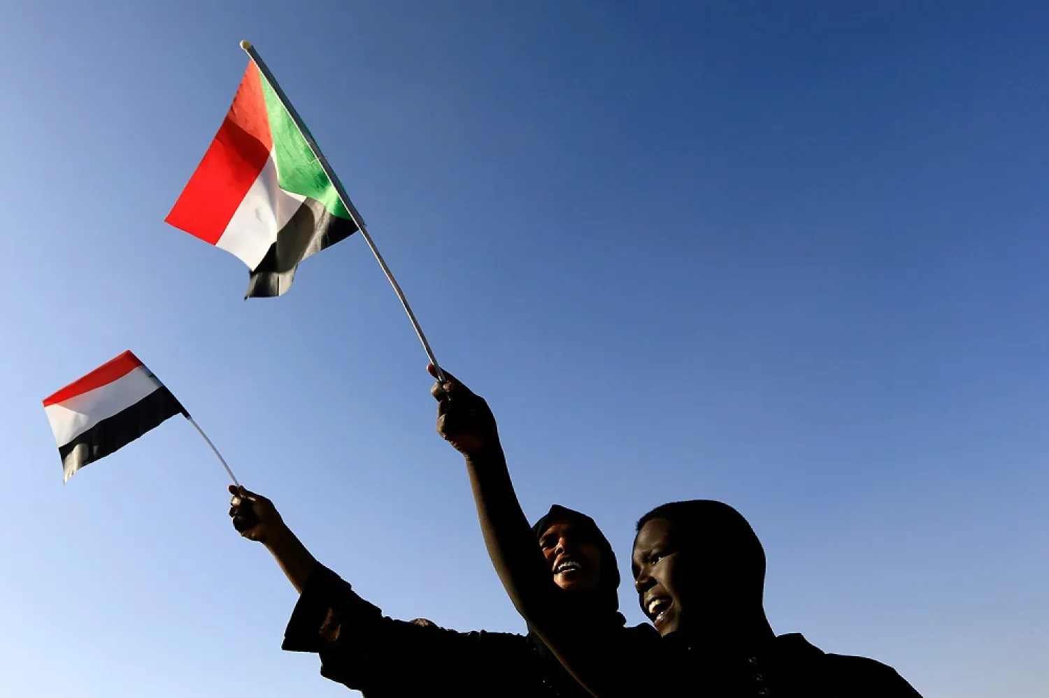 Civilians wave their national flag as they gather at the freedom square during the first anniversary of the start of the uprising that toppled Omar al-Bashir, in Khartoum, Sudan December 19, 2019. (Reuters)