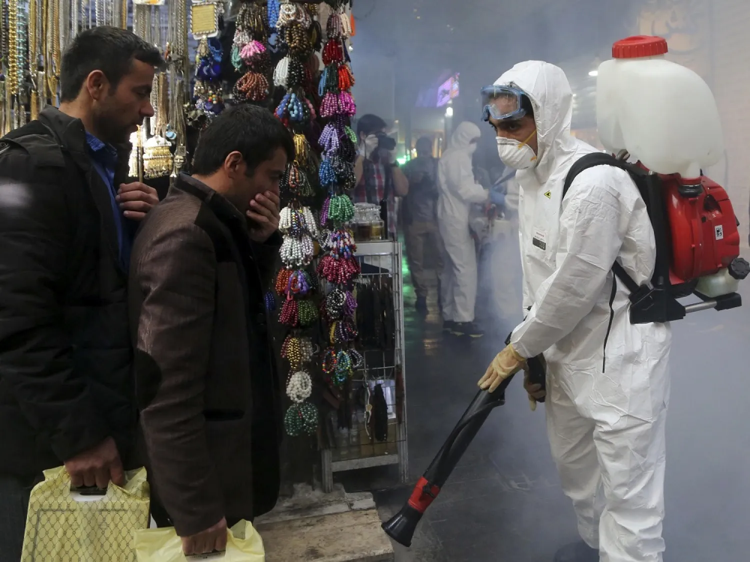 Firefighter teams with protective suits disinfect the Tajrish Bazaar as a precaution against the coronavirus in Tehran, Iran, on March 6. (Getty Images)