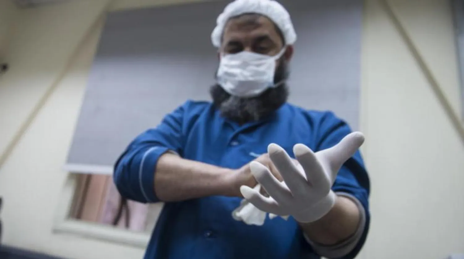 Egyptian worker wearing protective face mask. EPA