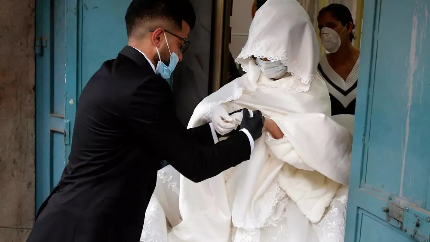 Palestinian groom Imad Sharaf picked up his bride Baraa Amarneh in the Dheishe refugee camp in Bethlehem to take her to his hometown for their wedding. (AFP)