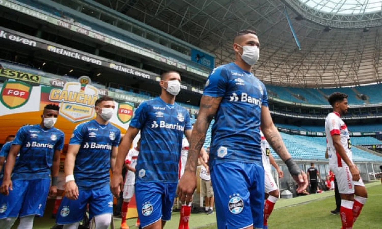  Grêmio players wear protective masks as a protest. Photograph: Richard Ducker/AFP via Getty Images
