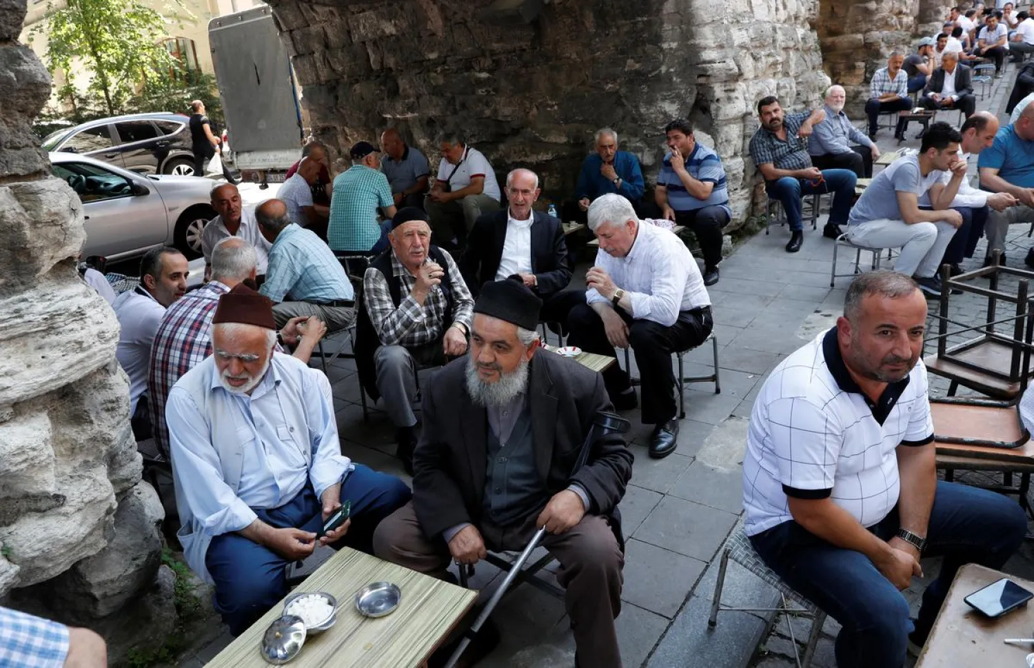 Men sit at an open-air cafe in Istanbul, Turkey (File photo: Reuters)
