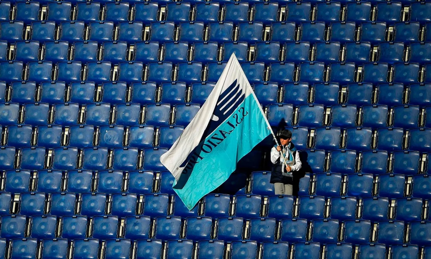 A young Lazio supporter amid empty seats at their 2-0 home win over Bologna – the last match they played before the Serie A shutdown. (Getty Images)