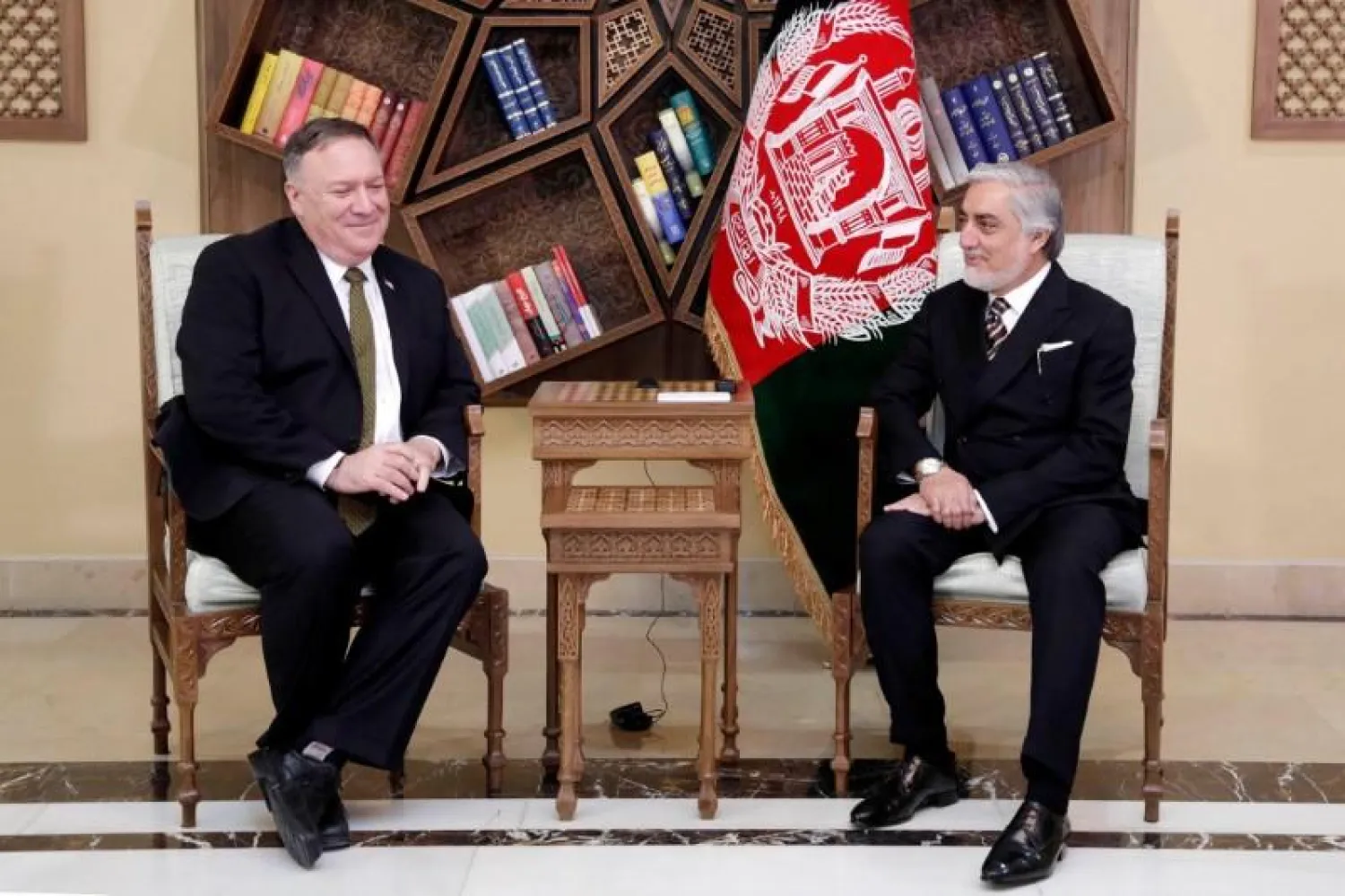 Afghanistan's Abdullah Abdullah, President Ashraf Ghani's political rival, meets with US Secretary of State Mike Pompeo in Kabul, Afghanistan March 23, 2020. Afghanistan's Chief Executive Office/Handout via REUTERS