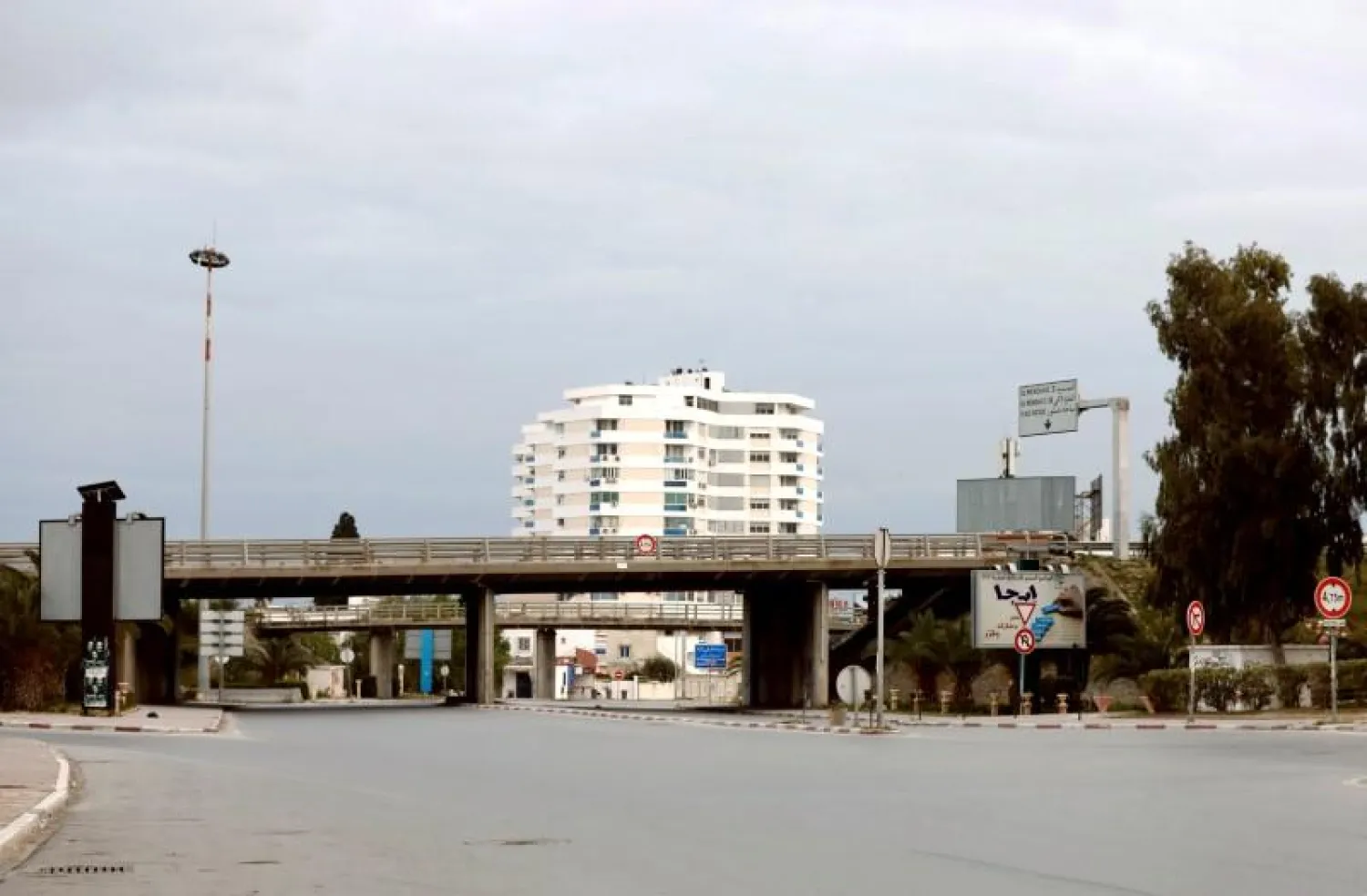 A general view shows empty streets at the entrance of Ariana city during a curfew to counter the spread of the coronavirus, near Tunis, Tunisia March 18, 2020. REUTERS/Zoubeir Souissi