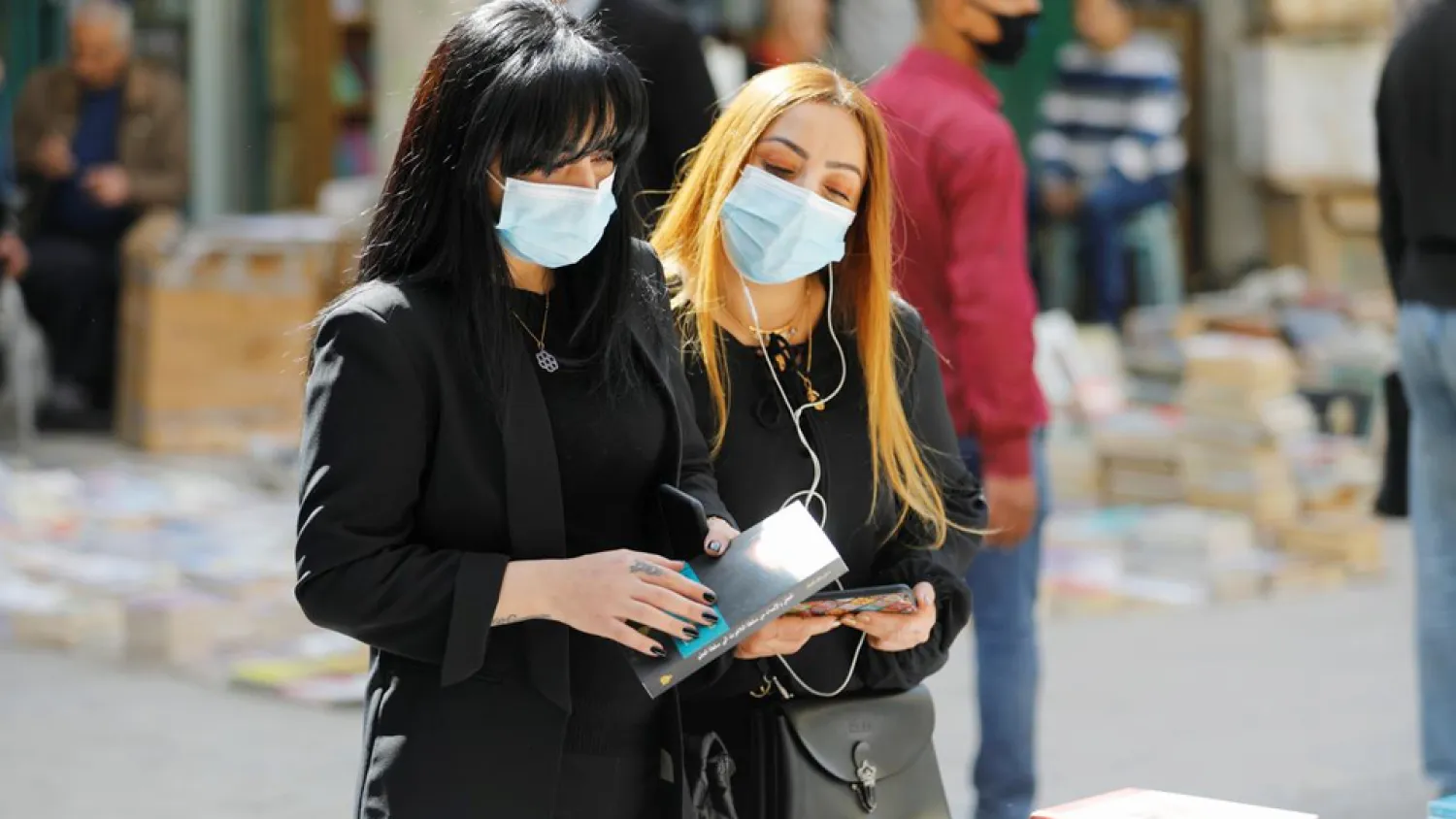 Iraqi women wearing masks on one of the neighborhoods of Capital Baghdad. (Photo: Reuters)
