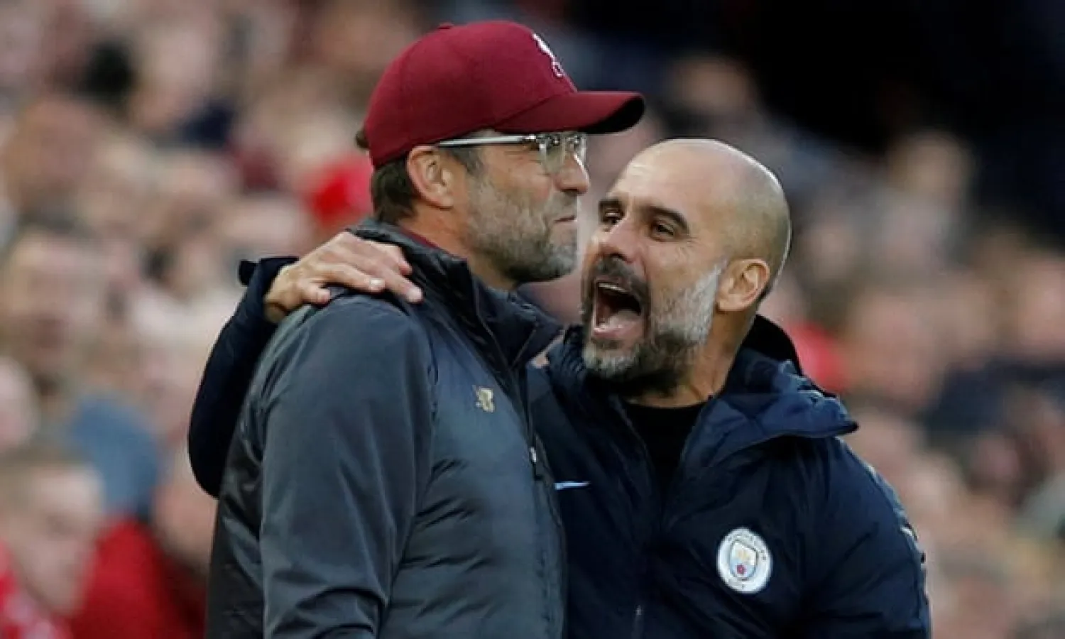  Jürgen Klopp and Pep Guardiola, coaches with contrasting styles tweaked to combat the other’s. What will they come up with next? Photograph: Phil Noble/Reuters
