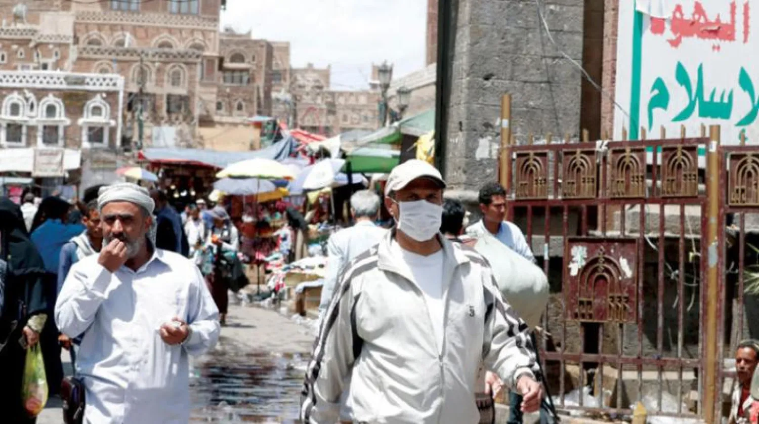 Yemenis wear protective face masks in Sanaa, EPA 

