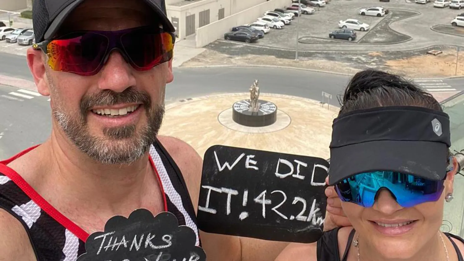 Collin Allin and wife Hilda covered the 42.2-kilometer (26-mile) distance by running more than 2,100 laps of their balcony from dawn on Saturday | AFP